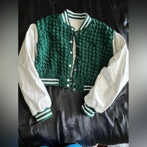 Green and white varsity like half jacket. Reversible